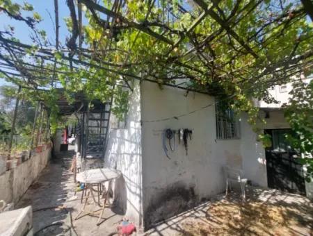 Muğla Köyceğiz Gülpınar’da Göl Yakını Bahçeli Kargir Köy Evi Satılık